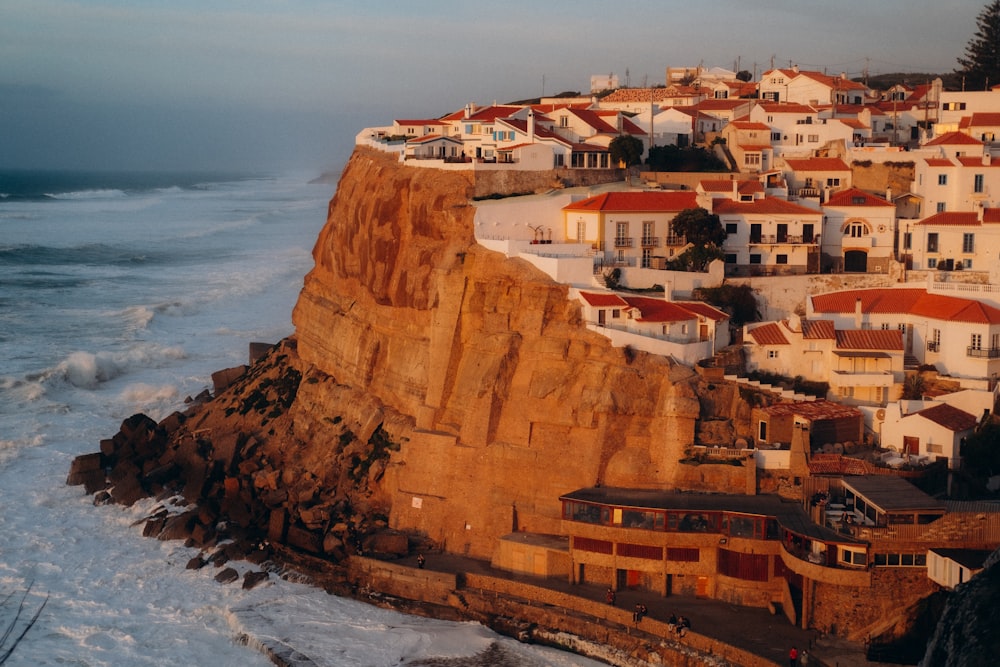 a town on a cliff overlooking the ocean
