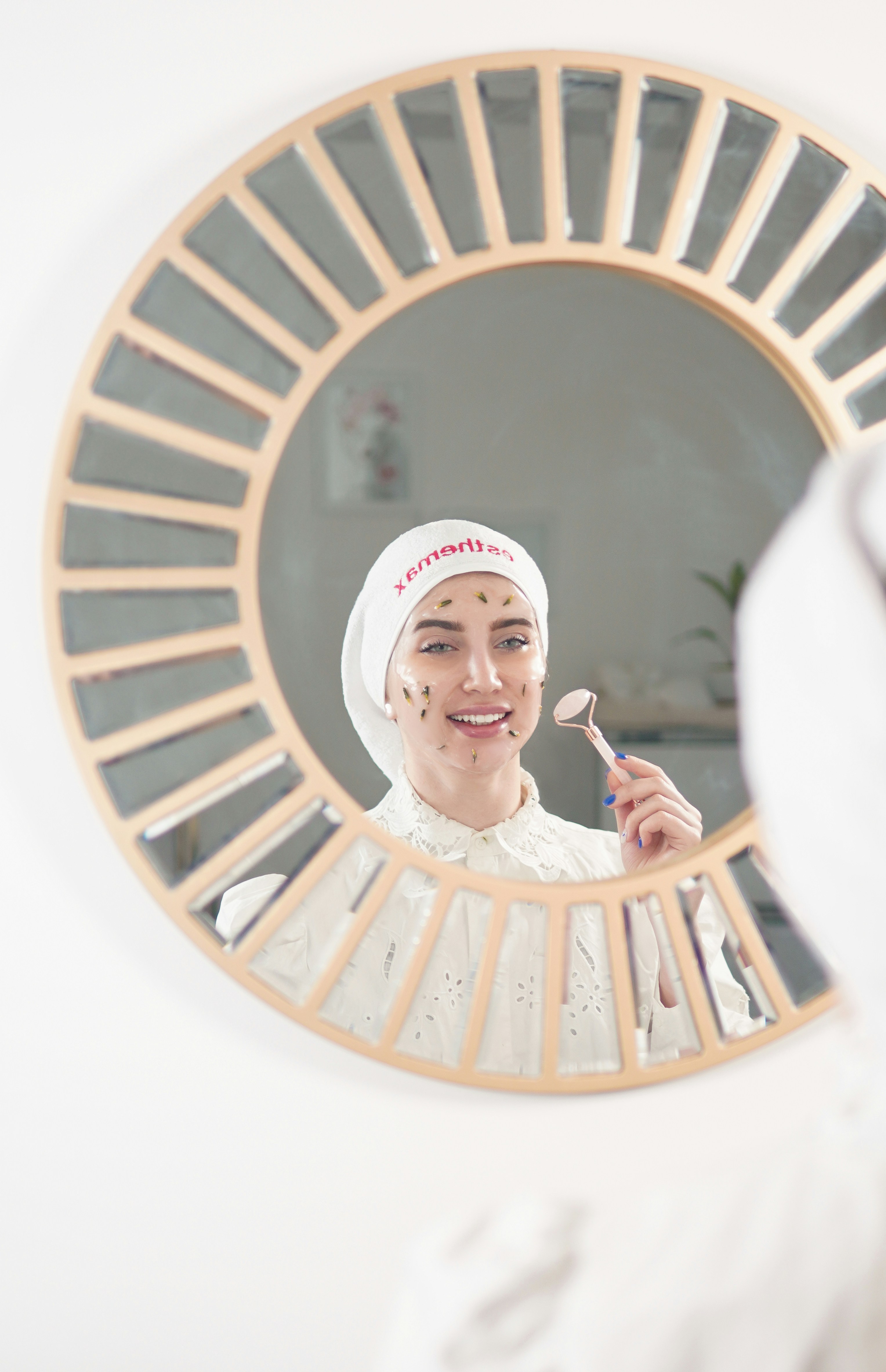 a woman in a white dress is brushing her teeth