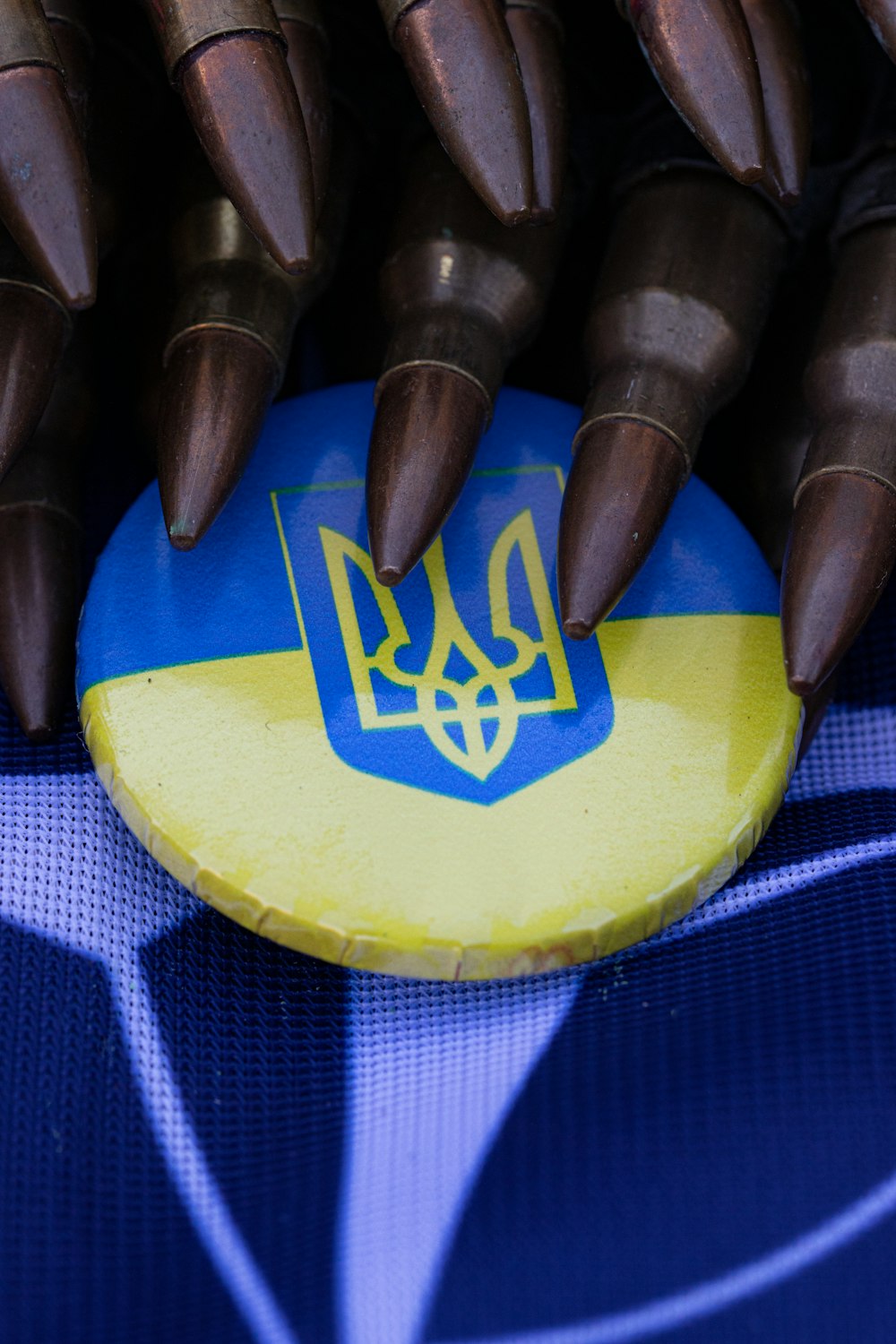 a close up of a blue and yellow frisbee