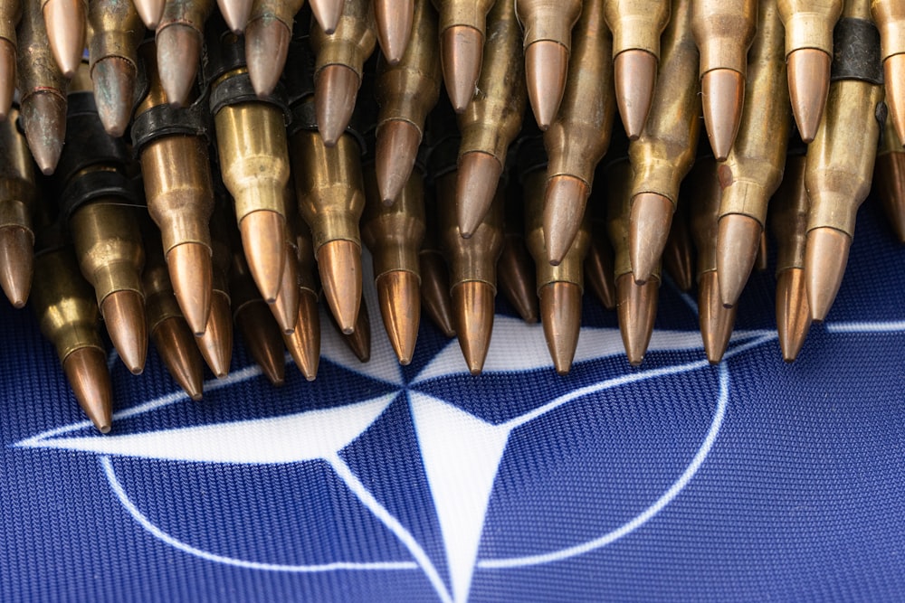 a bunch of bullet like objects on a blue background