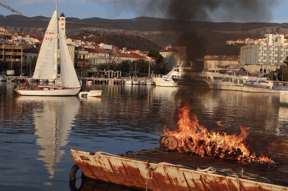 a boat on the water with a lot of smoke coming out of it