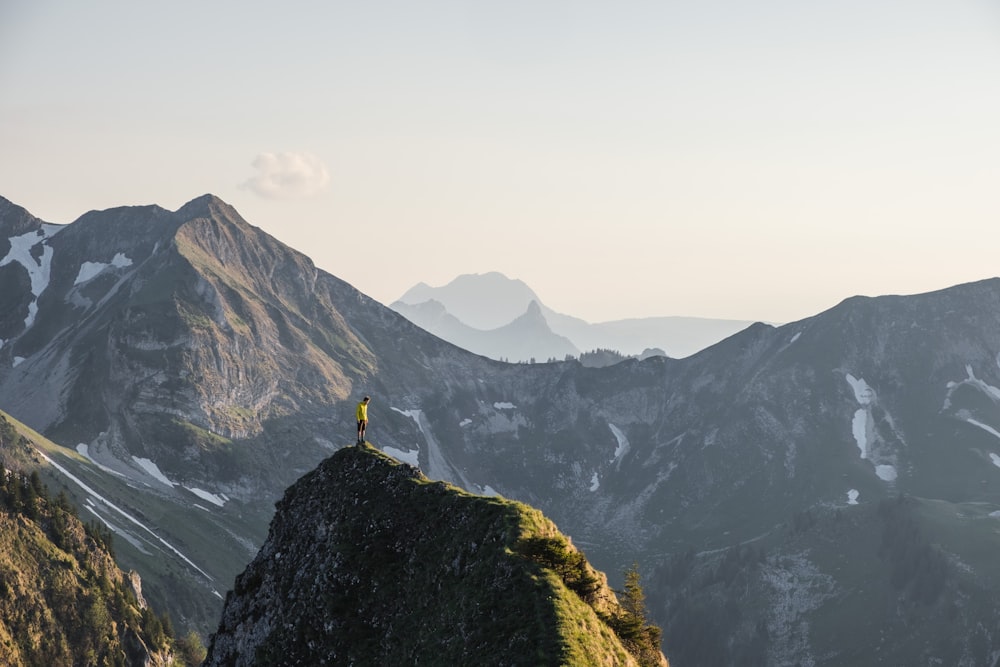 a person standing on top of a mountain