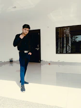 A confident security guard standing at a modern building entrance.