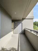 a balcony with a door and a balcony railing