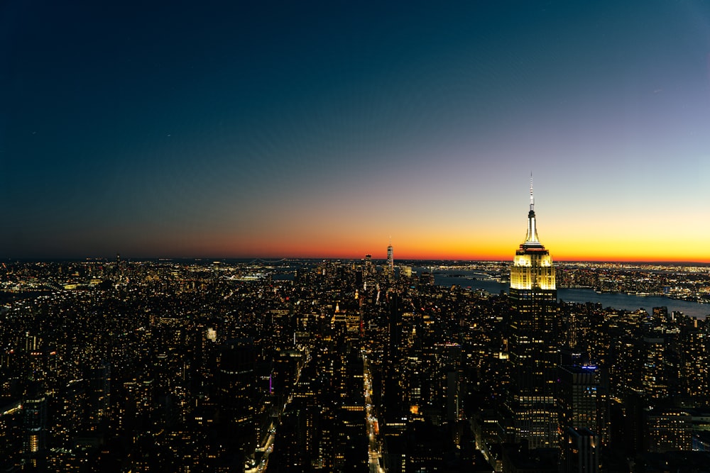 a view of a city at night from the top of a building