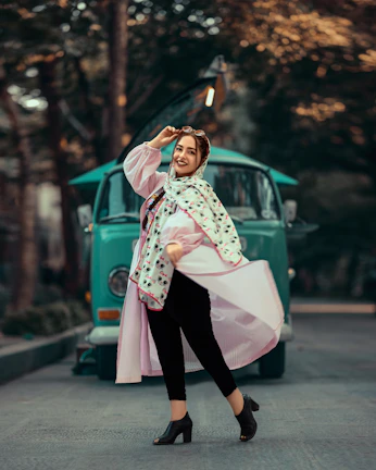 A smiling woman wearing a vibrant Vastraaura co-ord set at a sunny outdoor market