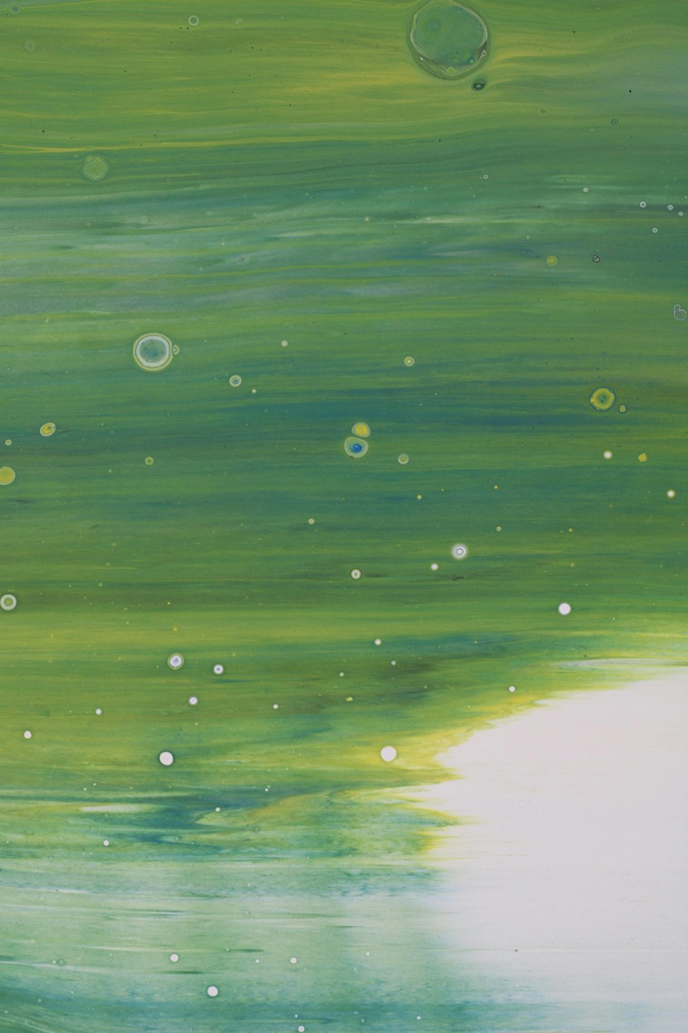 a painting of green and white with bubbles