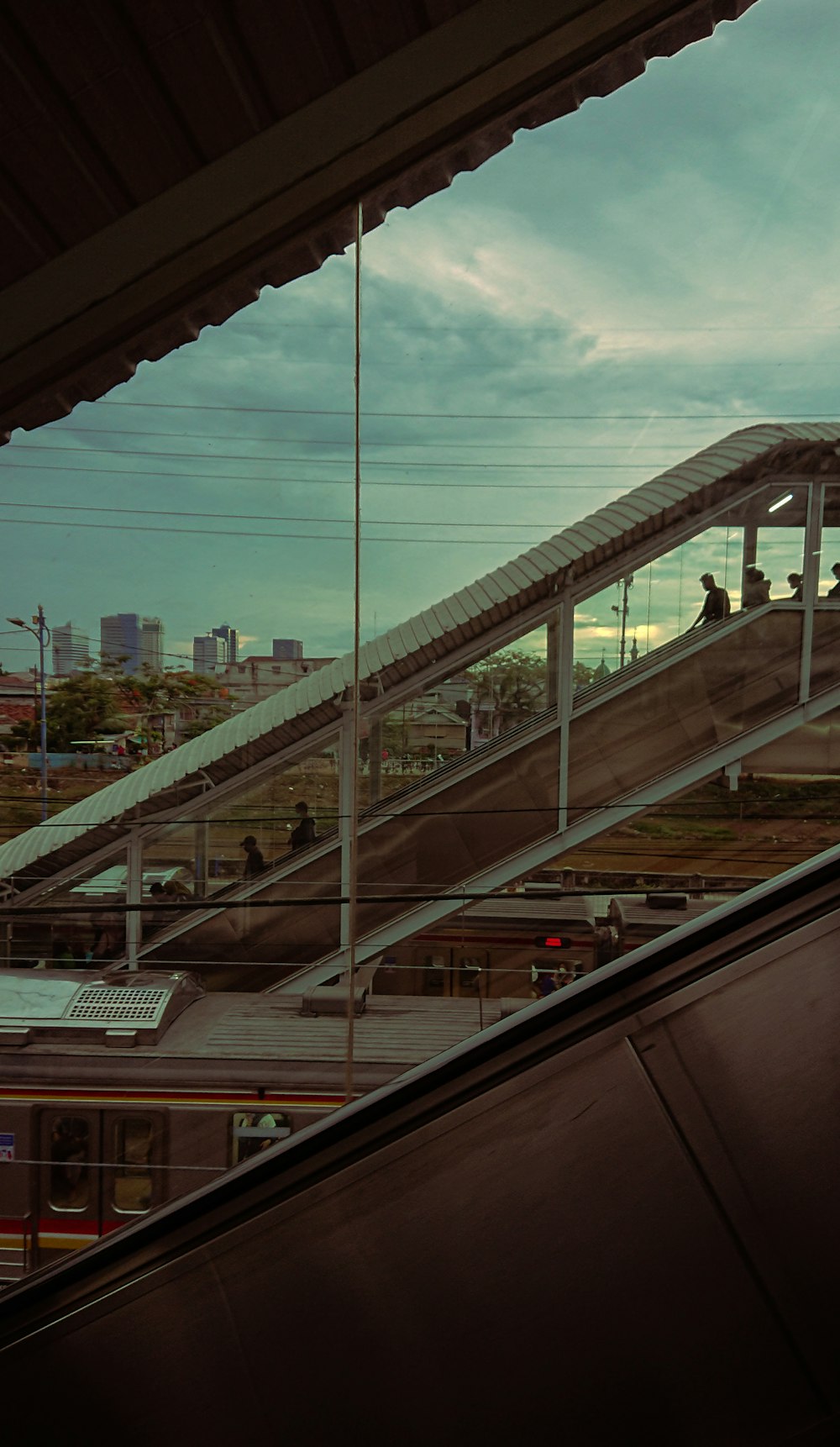 an escalator going up a hill with people on it