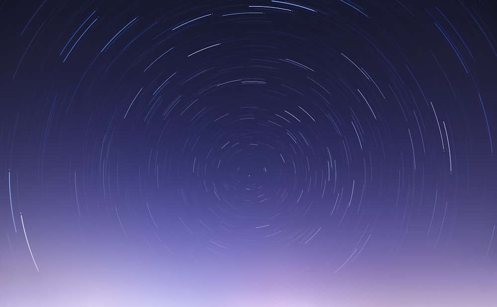 a star trail is seen in the night sky