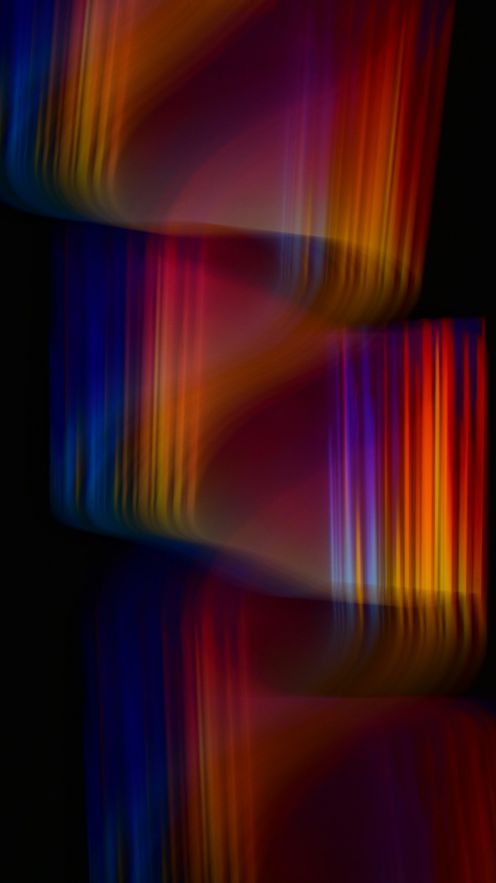 a blurry image of colorful lines in the dark