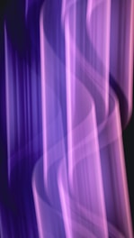 a blurry photo of a purple and black background