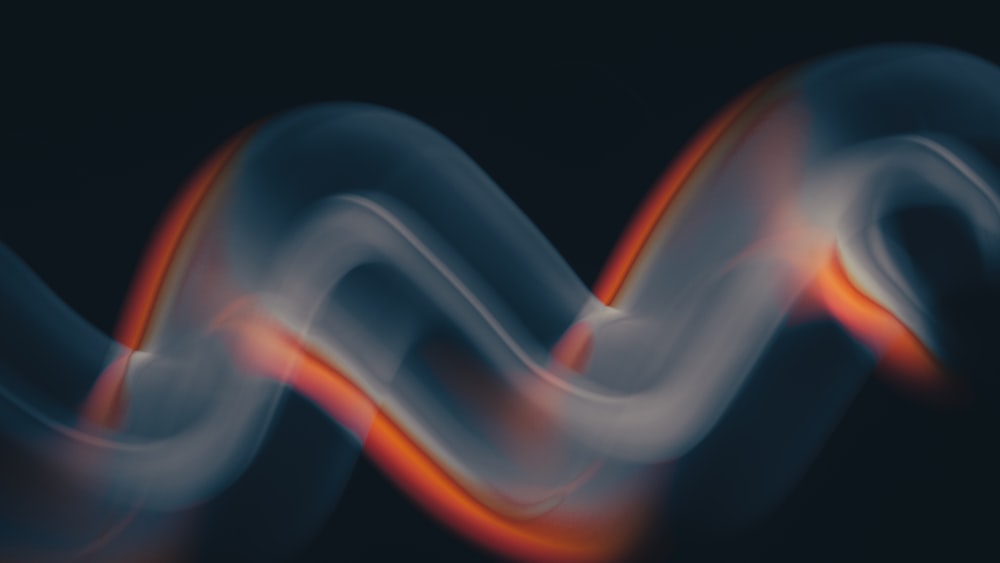 a blurry image of a wave on a black background