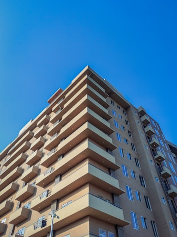 a tall building with balconies on the top of it