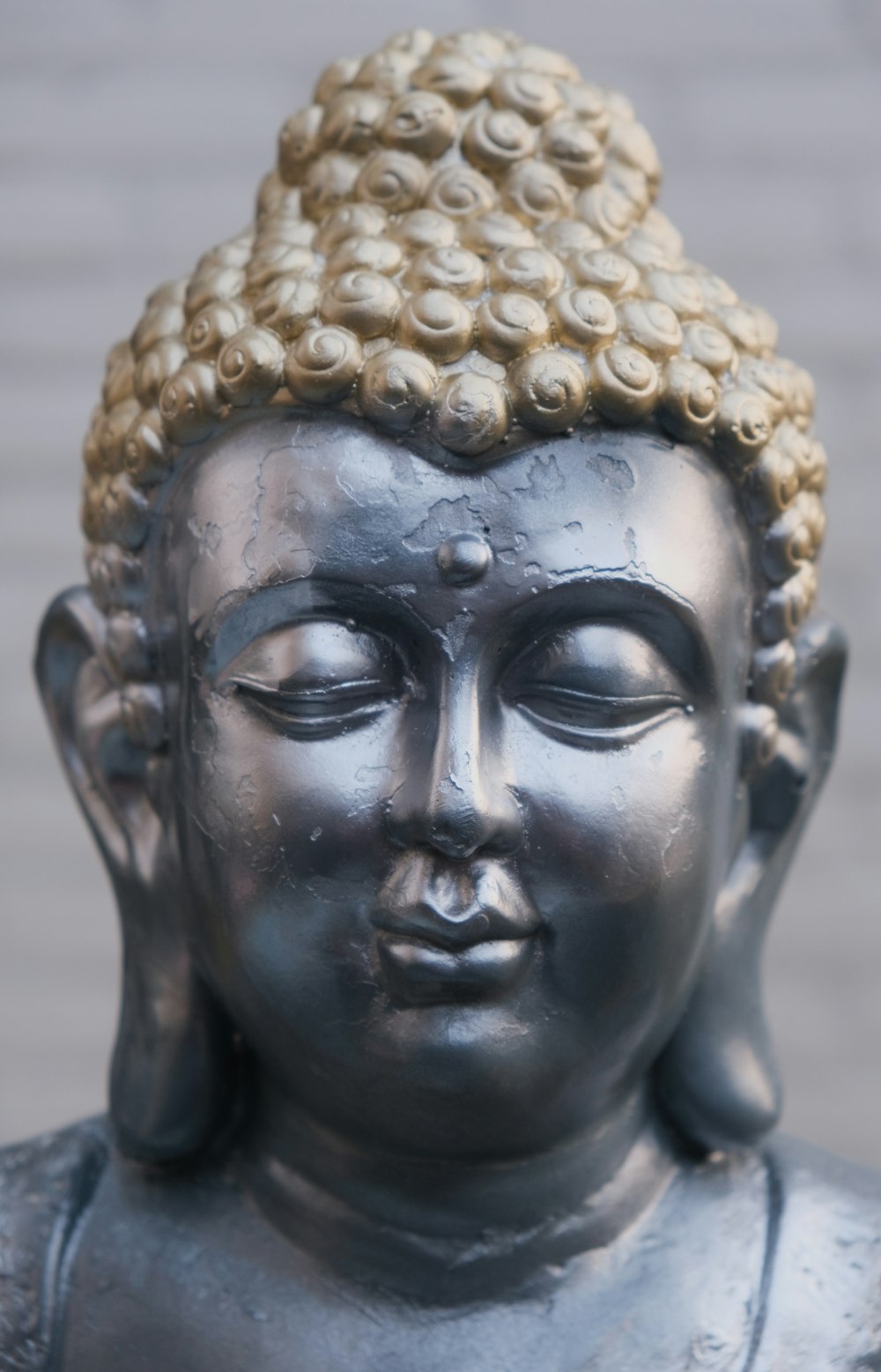 a close up of a statue of a buddha