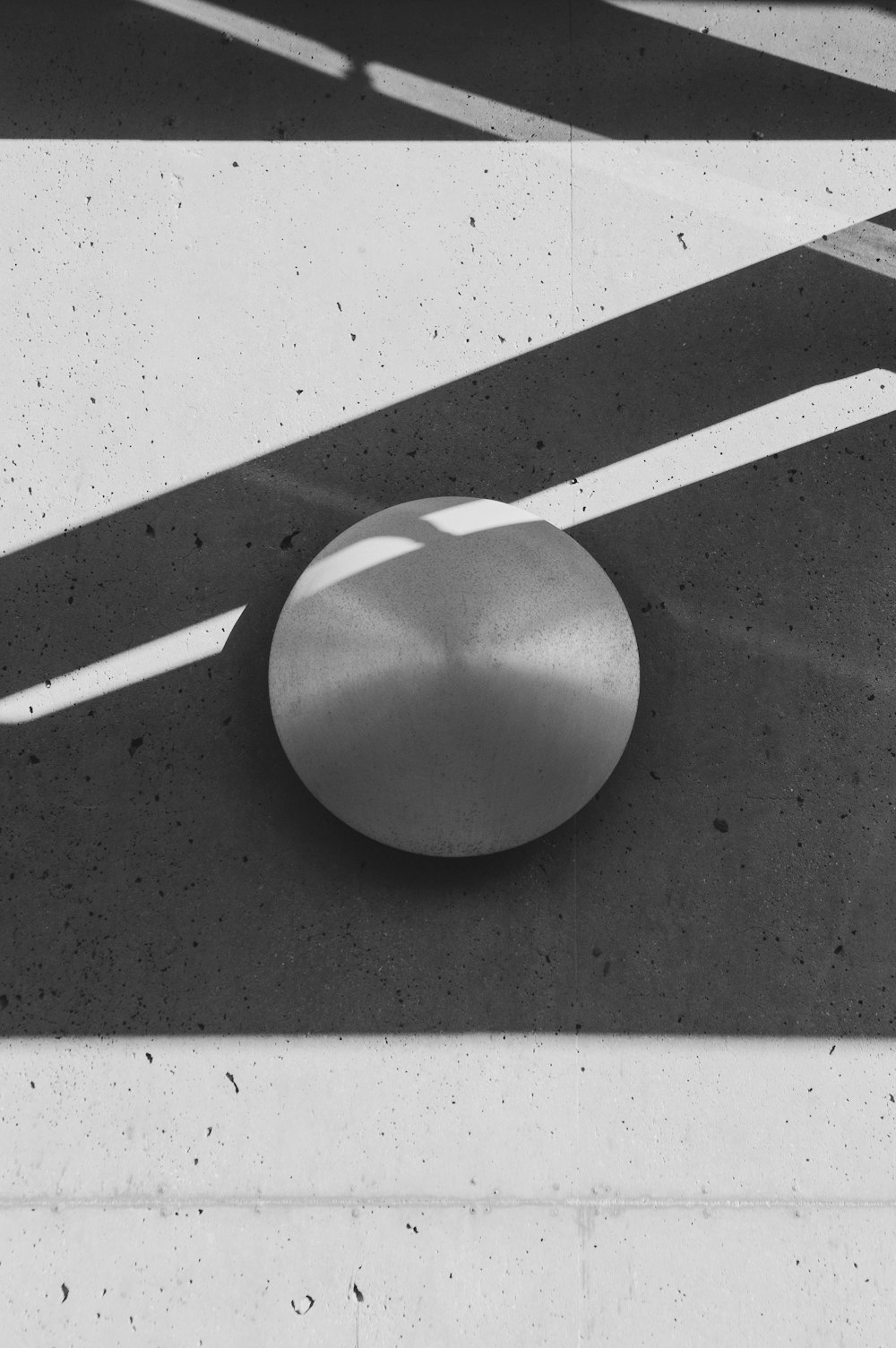 a black and white photo of a round object