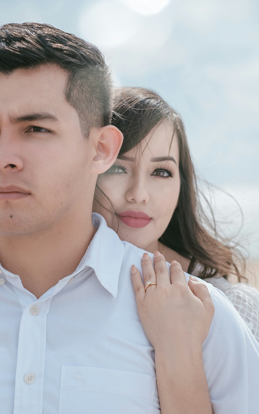 a man and a woman standing next to each other