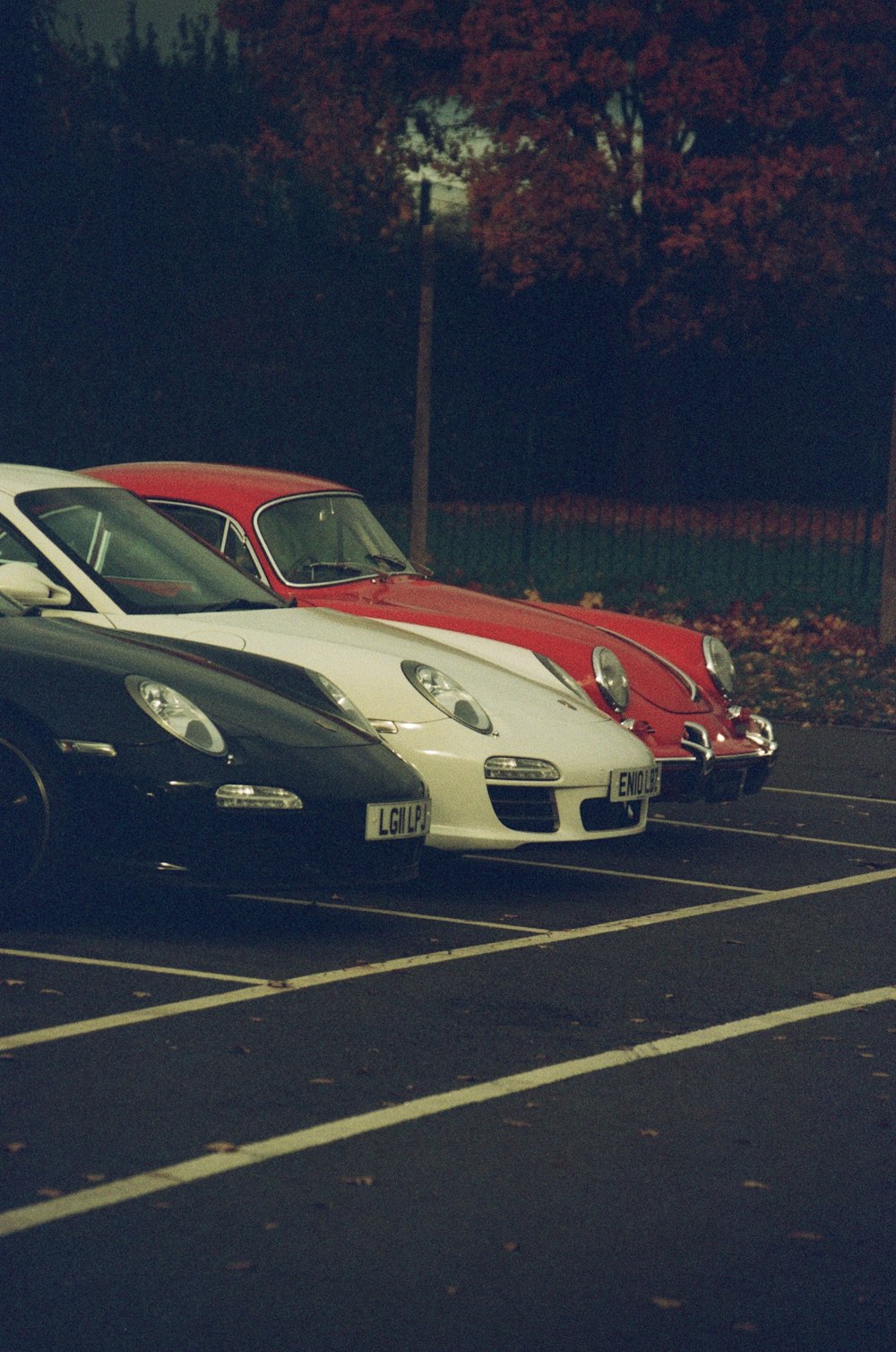 a row of cars parked in a parking lot