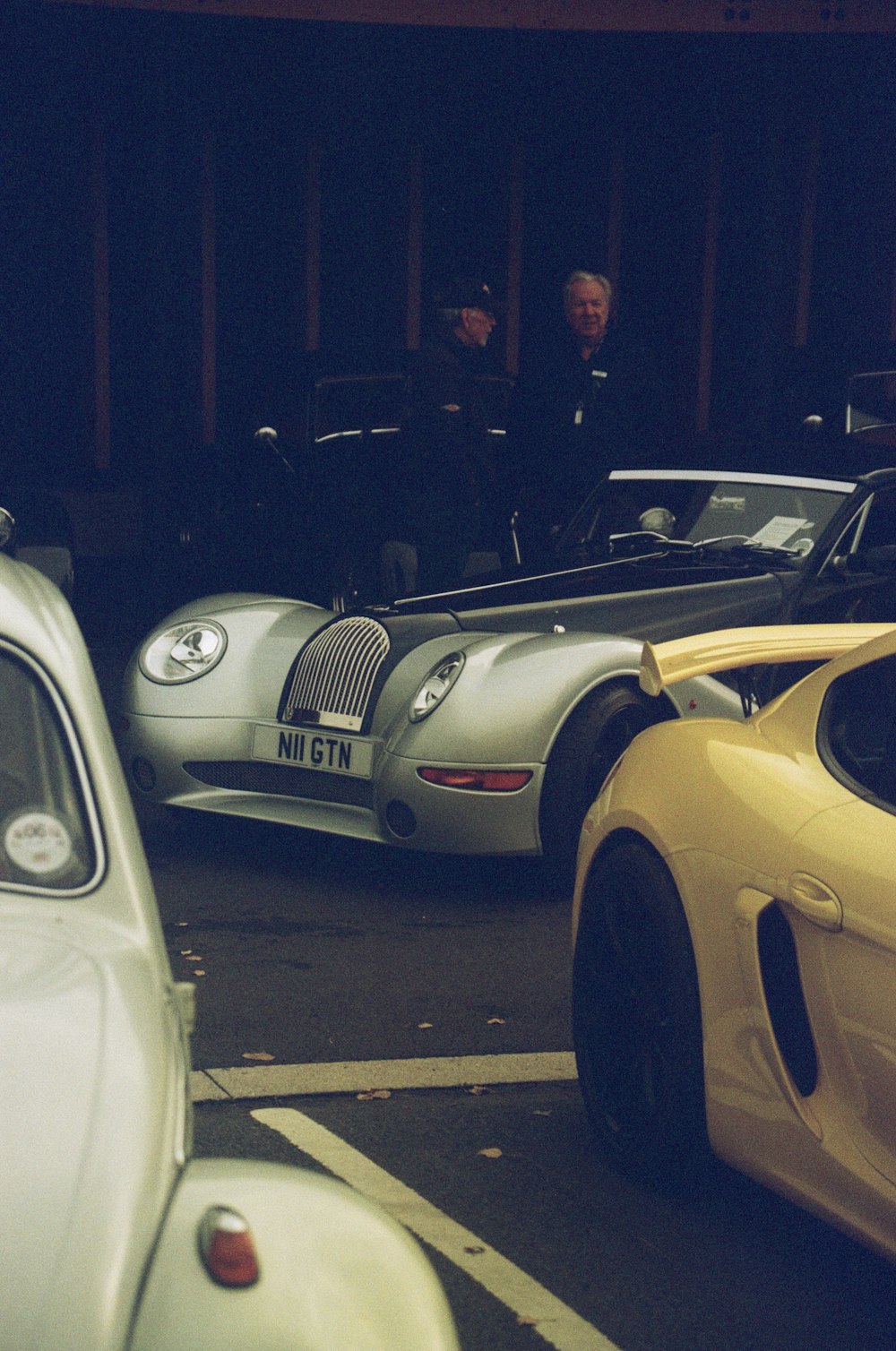 a group of cars parked in a parking lot