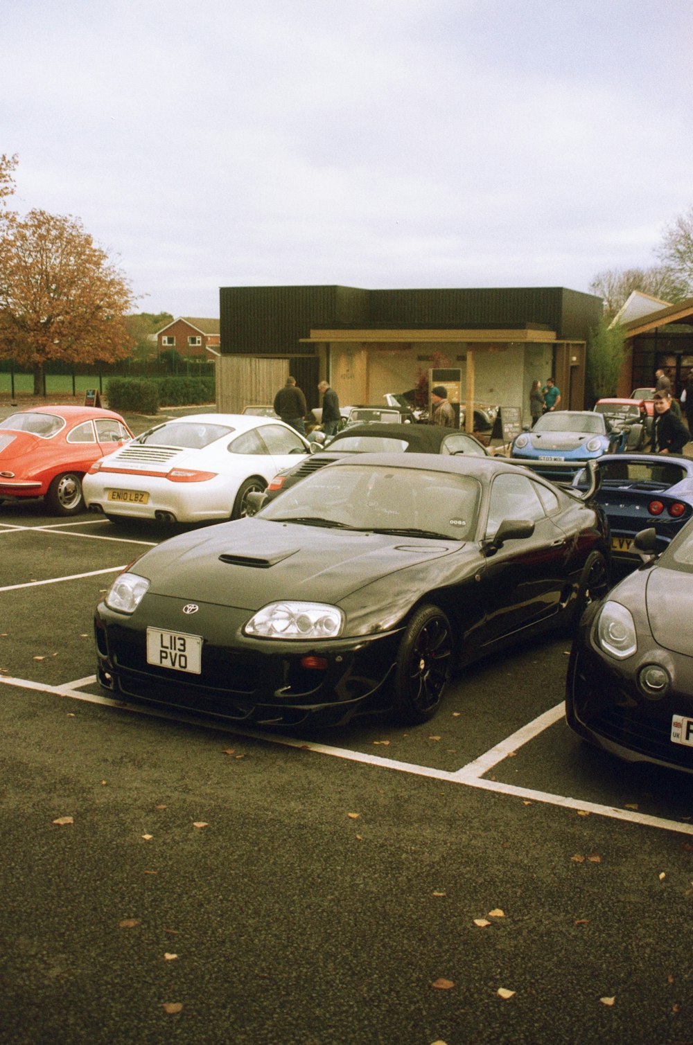 a parking lot filled with lots of parked cars