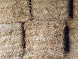 a close up of hay bales stacked on top of each other
