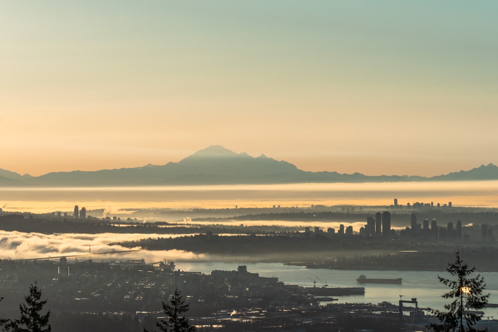 a view of a city with mountains in the background