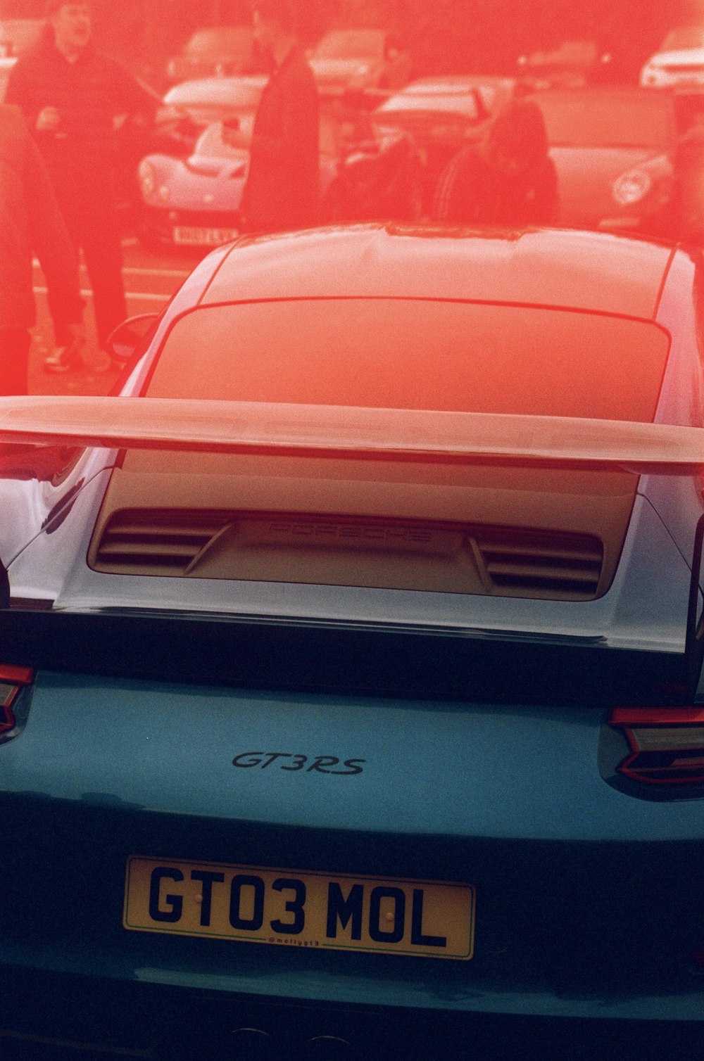 a blue sports car parked in a parking lot