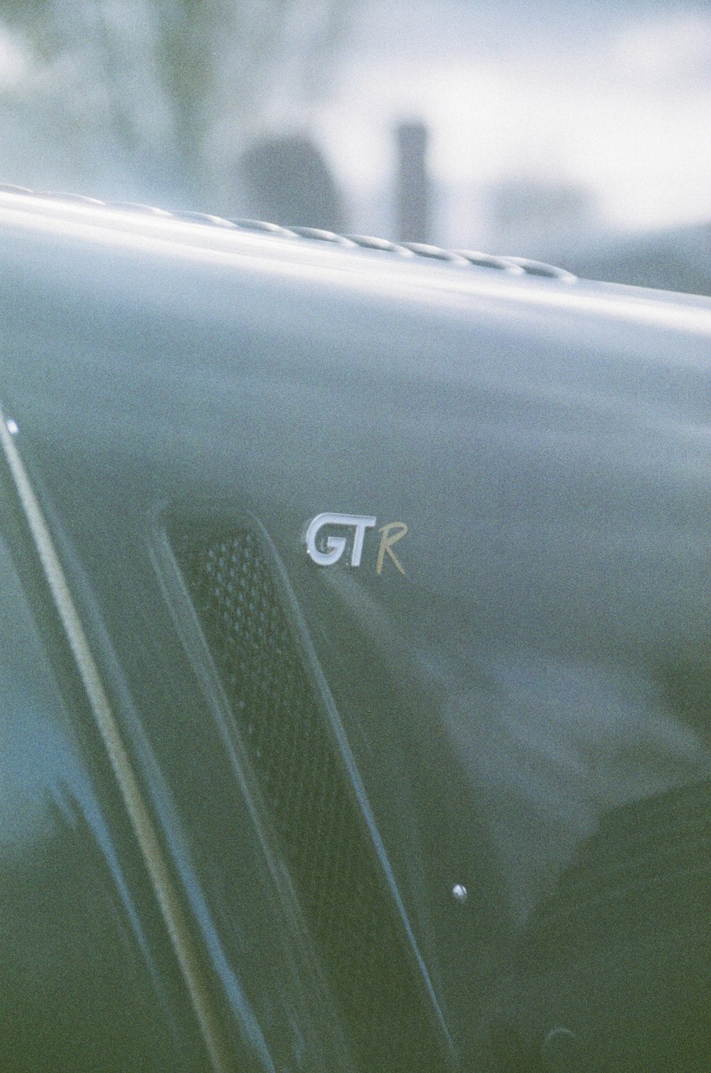 a close up of a car door with the word gtr on it
