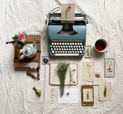 A serene writing desk with a vintage typewriter, scattered pages of heartfelt poetry, and a cup of tea.