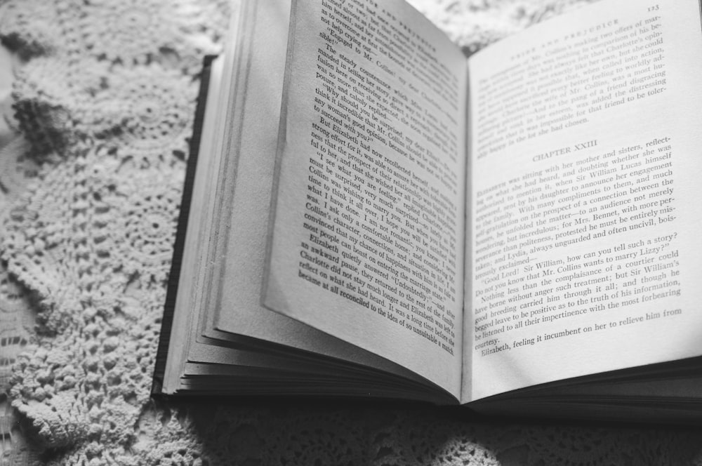 a black and white photo of an open book