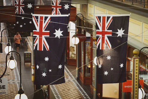 flags hanging from the ceiling of a shopping mall