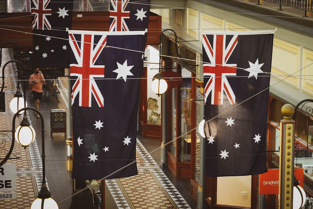 flags hanging from the ceiling of a shopping mall