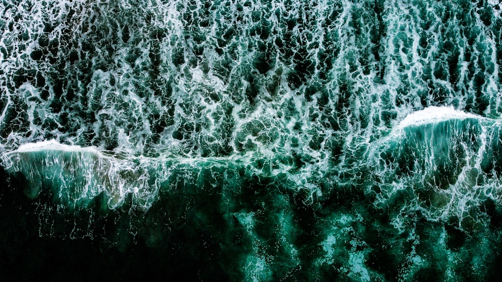 a large body of water surrounded by waves