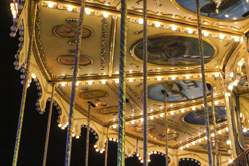 a merry go round at night with lights on it