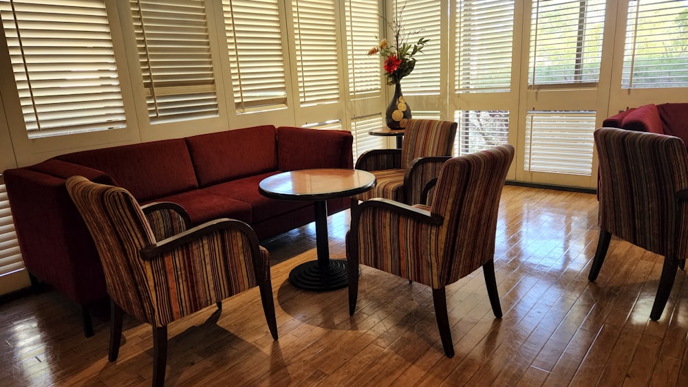 a living room filled with furniture and wooden floors