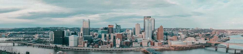 a view of a city with a bridge and a river