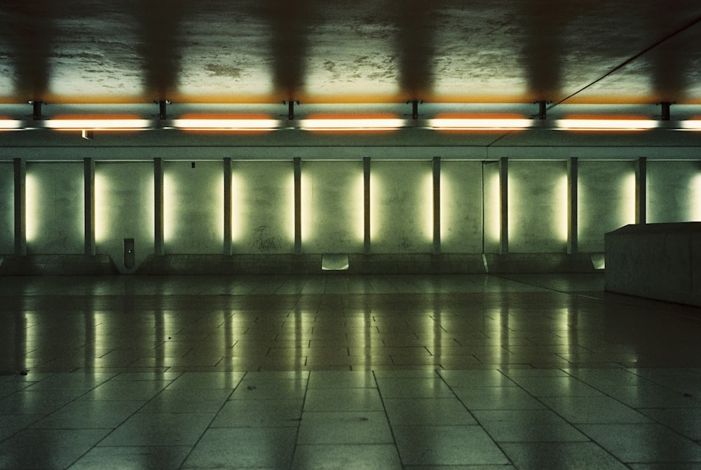 an empty room with a lot of lights on the ceiling