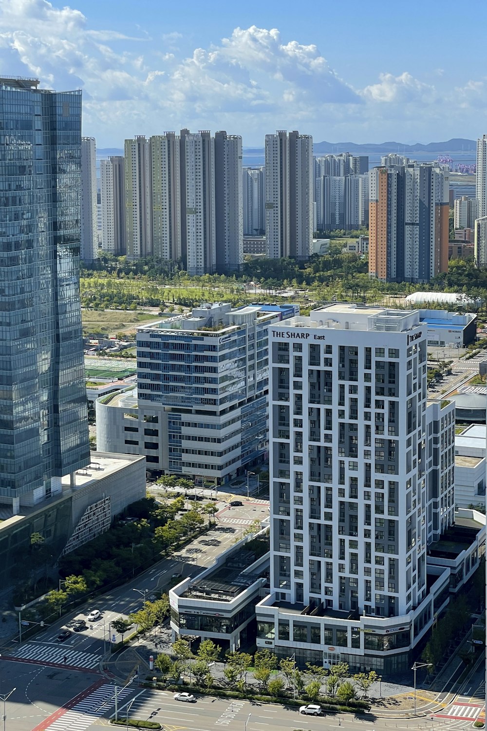 an aerial view of a city with tall buildings