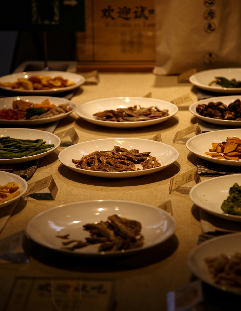 a table topped with lots of plates of food