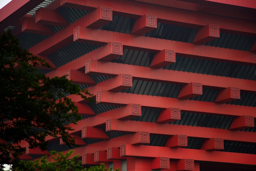 a red building that has a bunch of windows on it