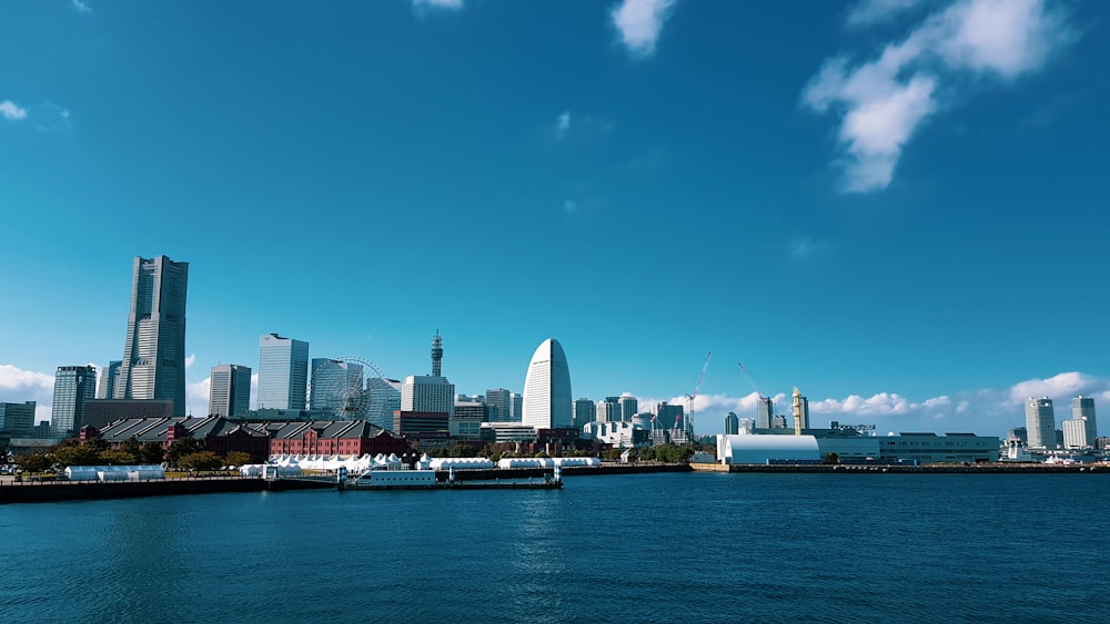 a large body of water with a city in the background