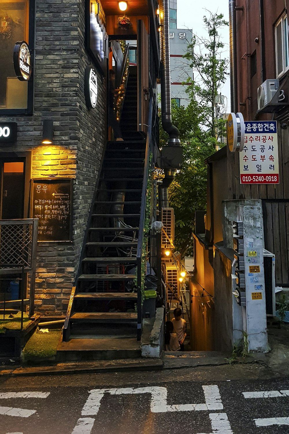 a set of stairs leading up to a restaurant