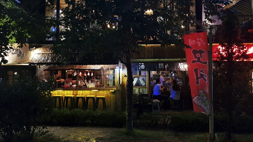 A Hongdae street at night near Seogyo-dong, Mapo-gu, lit up with bars and signs