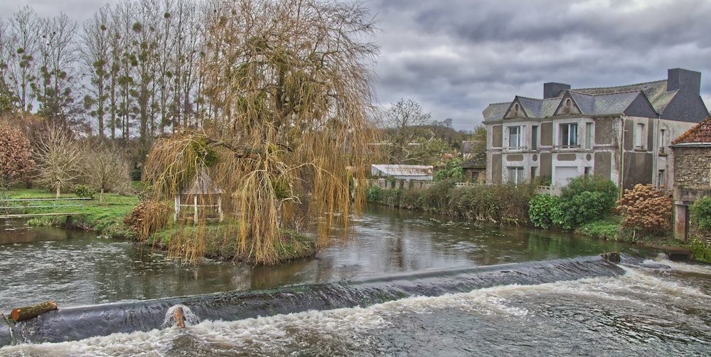 a river running through a lush green countryside