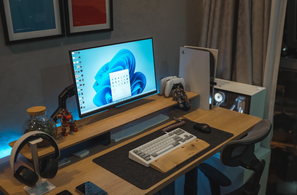 a desktop computer sitting on top of a wooden desk