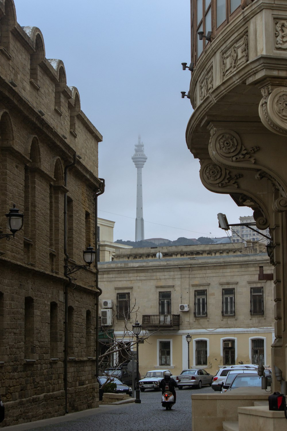 a view of a street with cars parked on the side of it