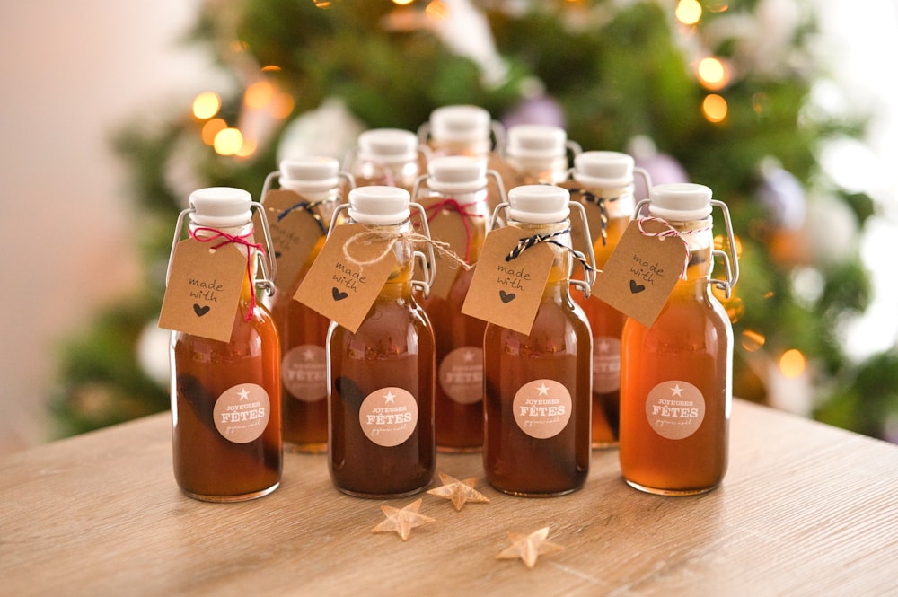 a group of bottles of honey sit on a table