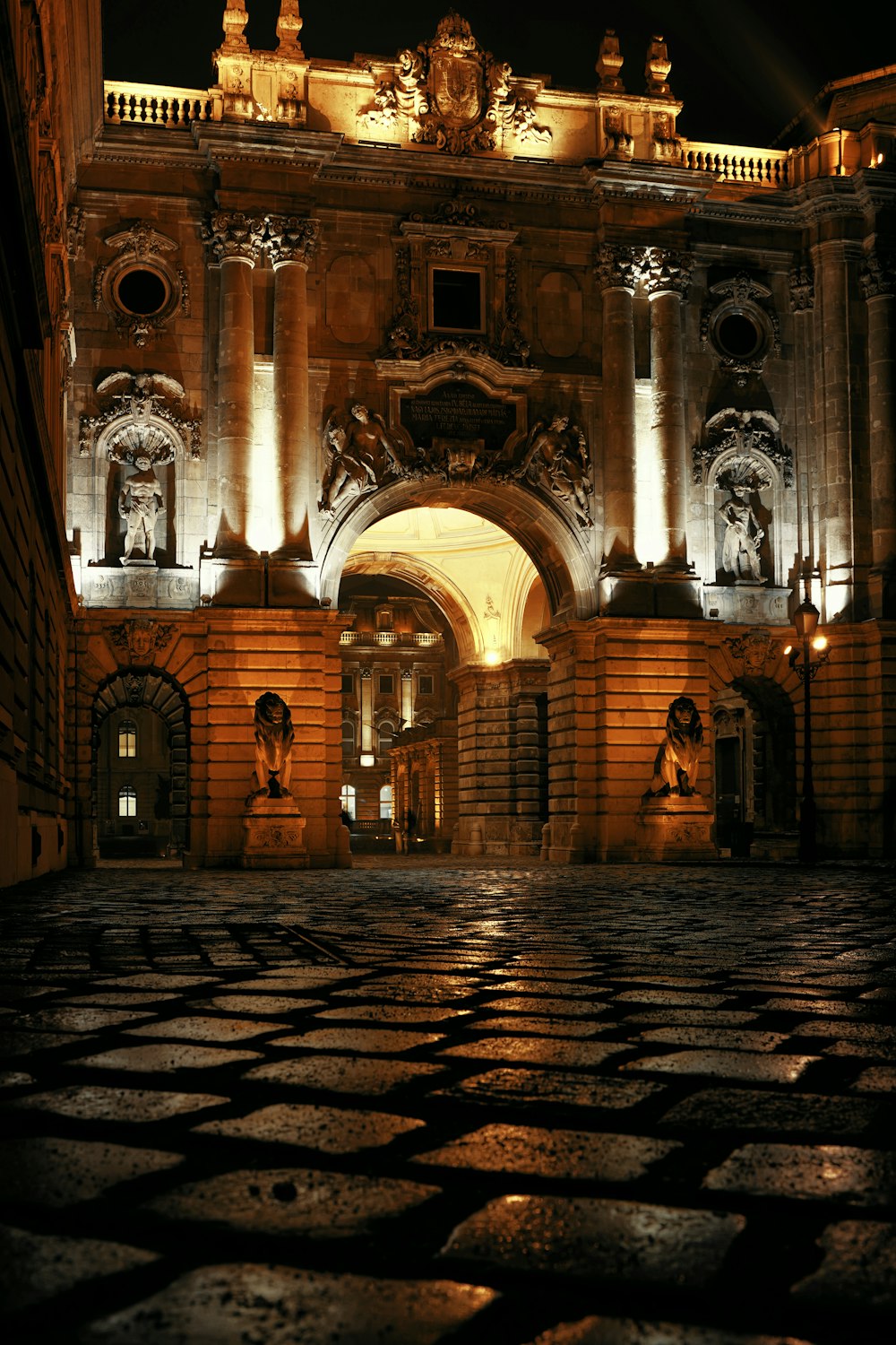 a large building with a lit up entrance