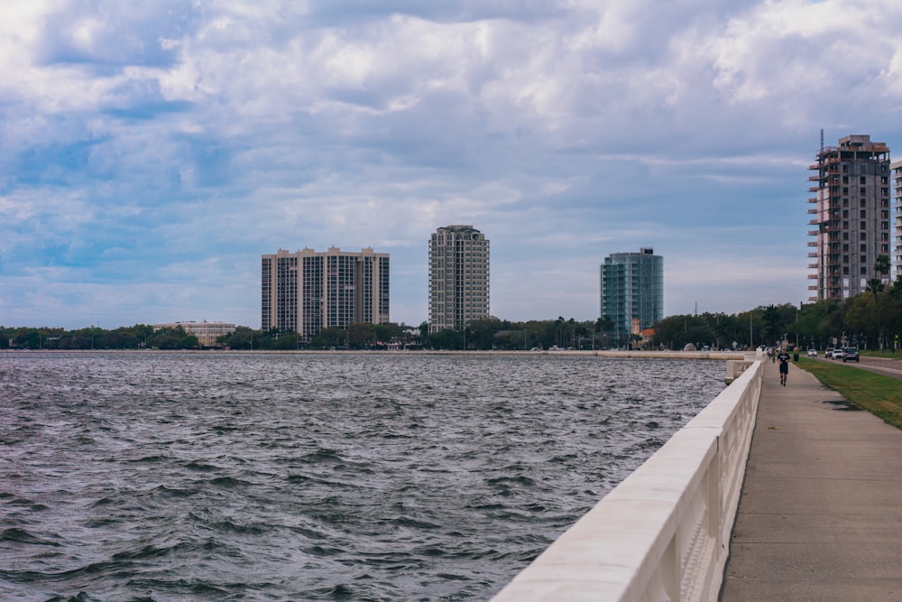 a view of a body of water with buildings in the background