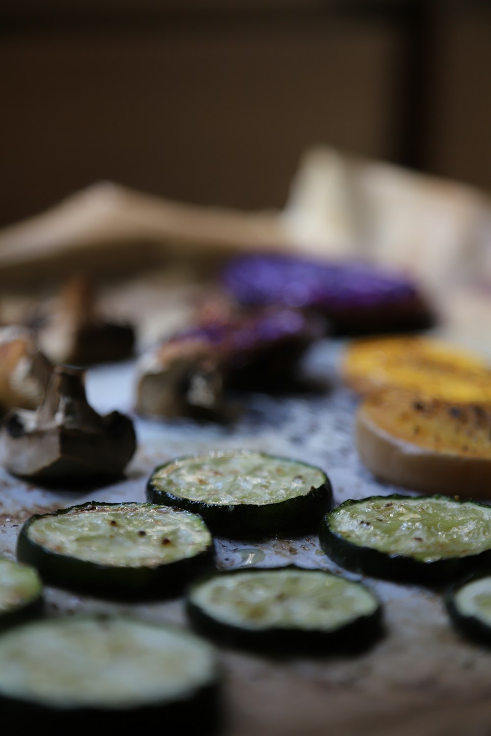 a table topped with lots of sliced cucumbers