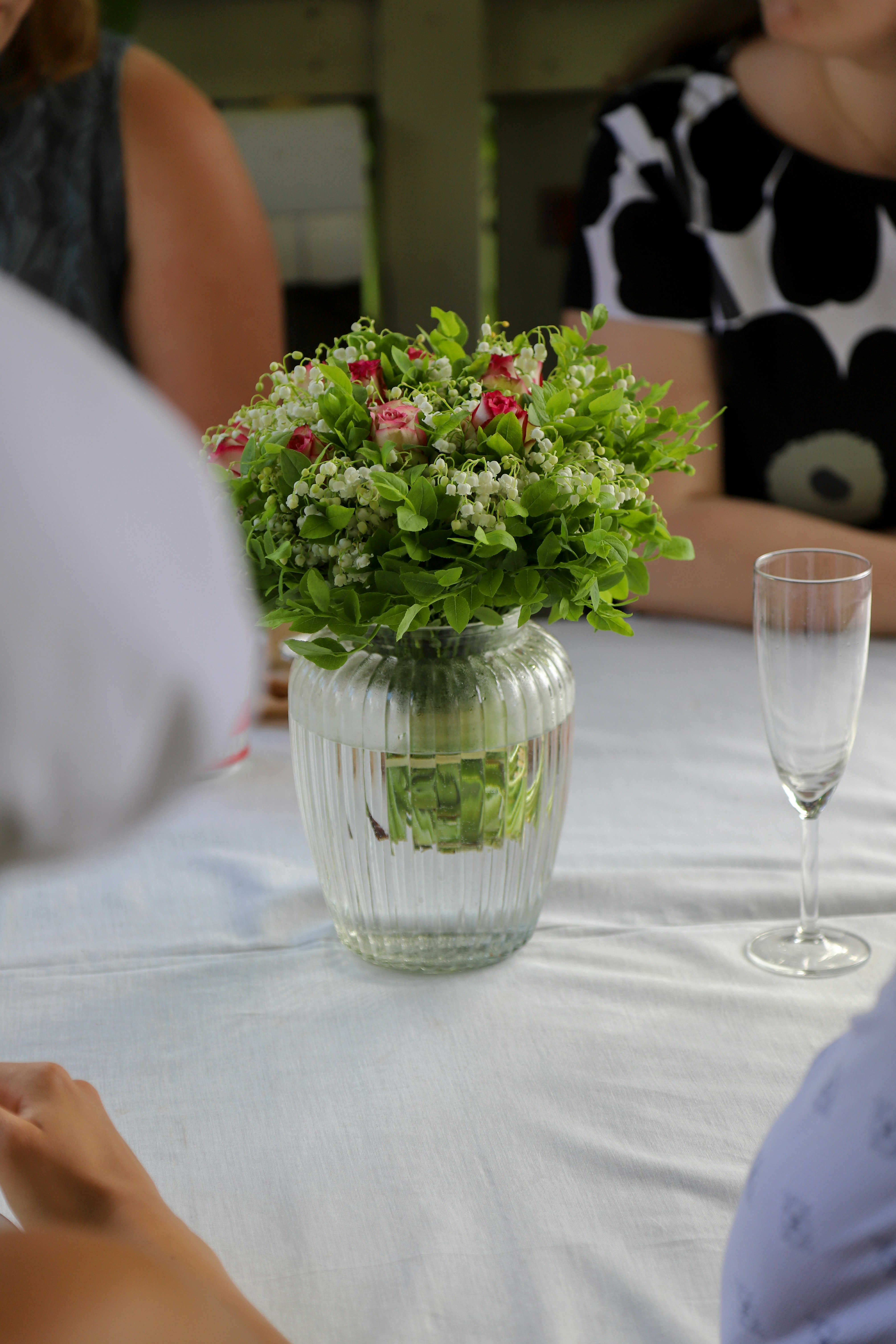 a vase filled with flowers sitting on top of a table